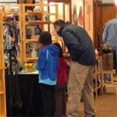 art enthusiasts look at art on display at 2019 Arts@TheOval