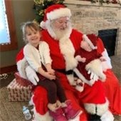 Children hang out with Santa at Cookies with Kris Kringle.