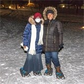 Community members pose for a picture at the Candlelit Snowshoe event.