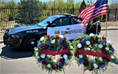 Roseville police squad with two wreaths; one for each of RPD's Fallen Officers Johnson - Russell. 