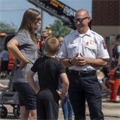 Chief David Brosnahan talks with local community members.