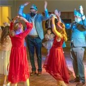 People dancing in a circle at the Sweetheart Dance.