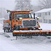 A Roseville snow plow on a winter morning.