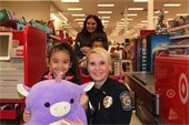 Deputy Chief Scheider with partner at Shop with a Cop