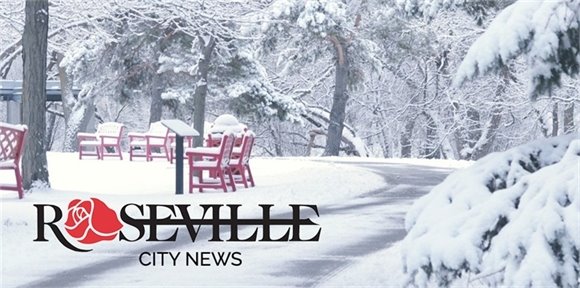 A park bench covered in snow at Central Park.