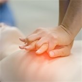 A picture of someone demonstrating how to do CPR.