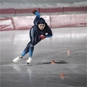 A speed skater focuses on making a turn at the Guidant John Rose MN OVAL.