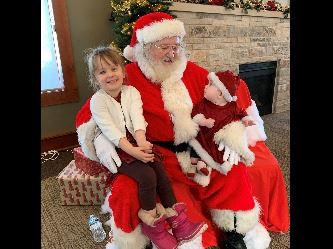 Edy and Ivy Robbins with Santa 2021