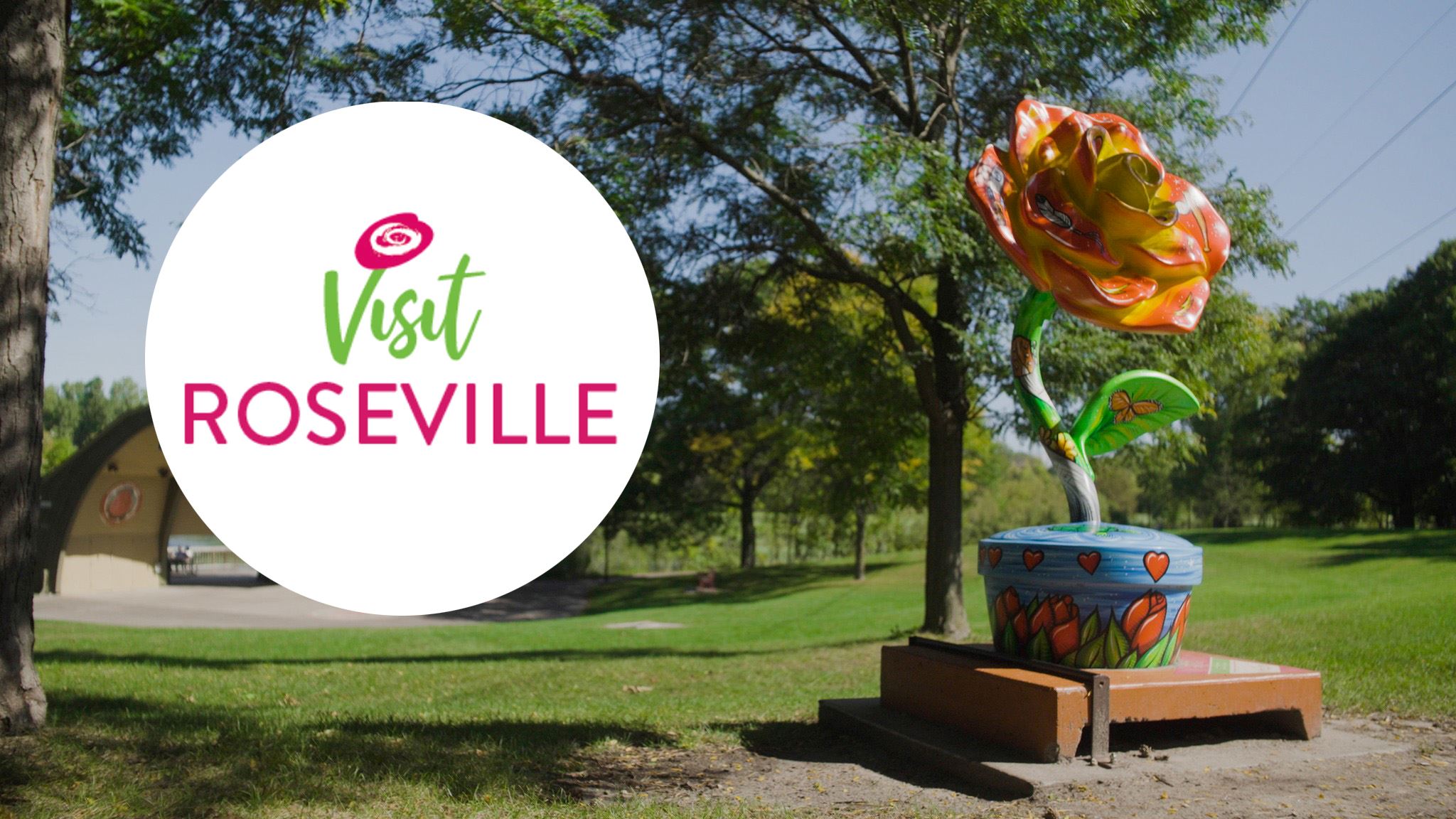 Visit Roseville logo and rose statue.