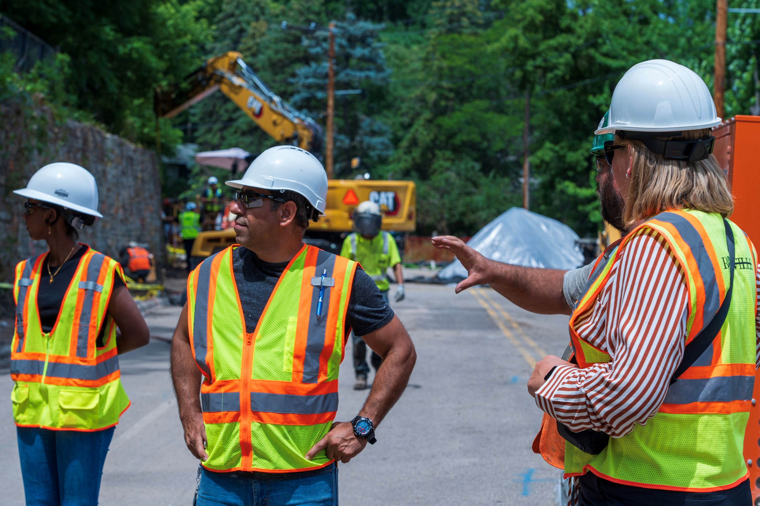 Public Works employees working on a new retaining wall at Lake McCarrons.