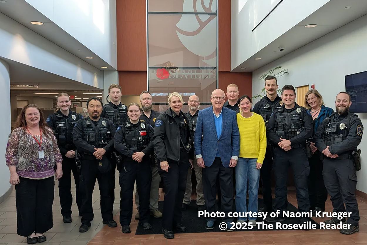 Roseville Police poses with the Madden family.