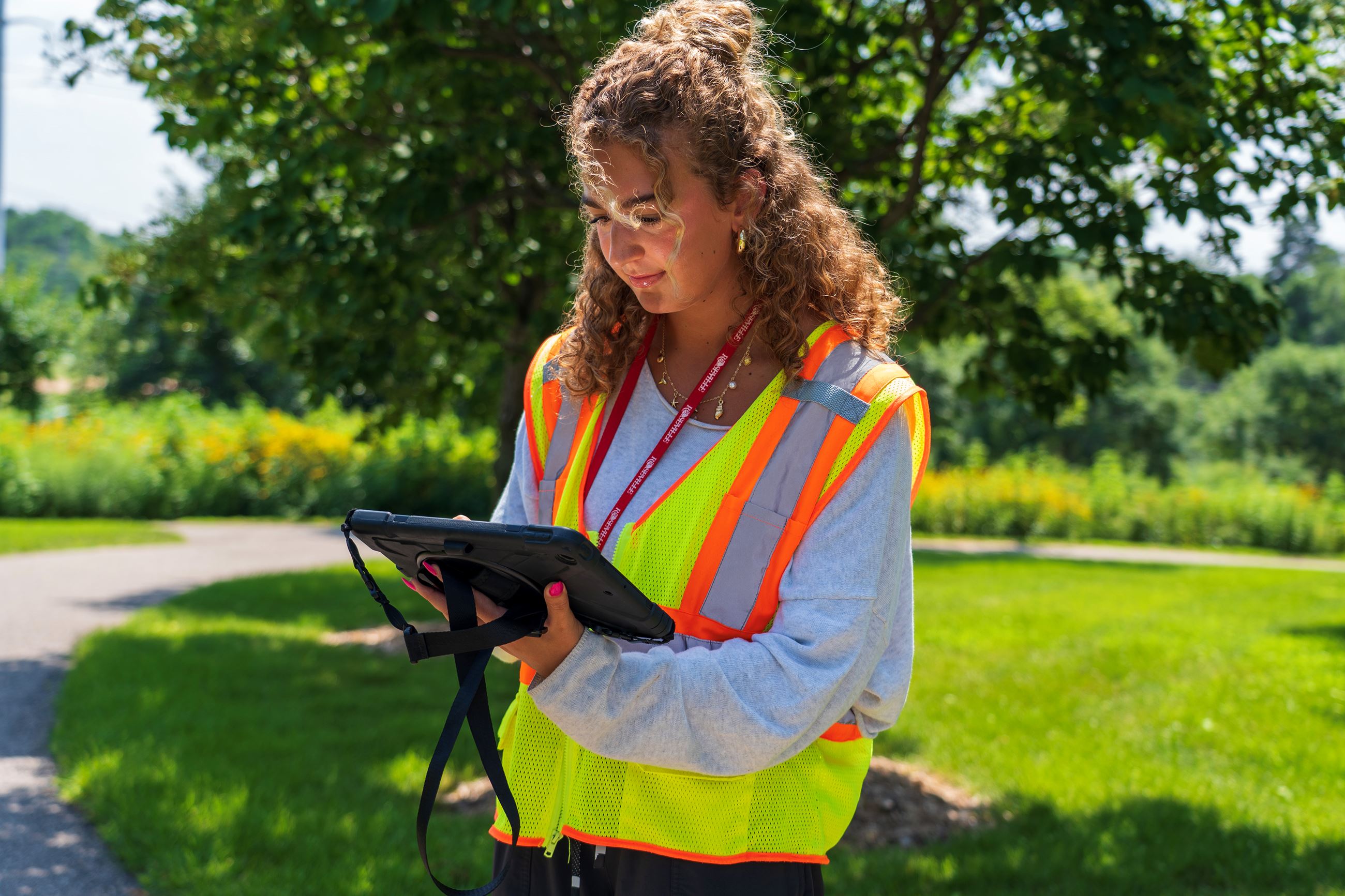 An image shows a Neighborhood Enhancement Program inspector.